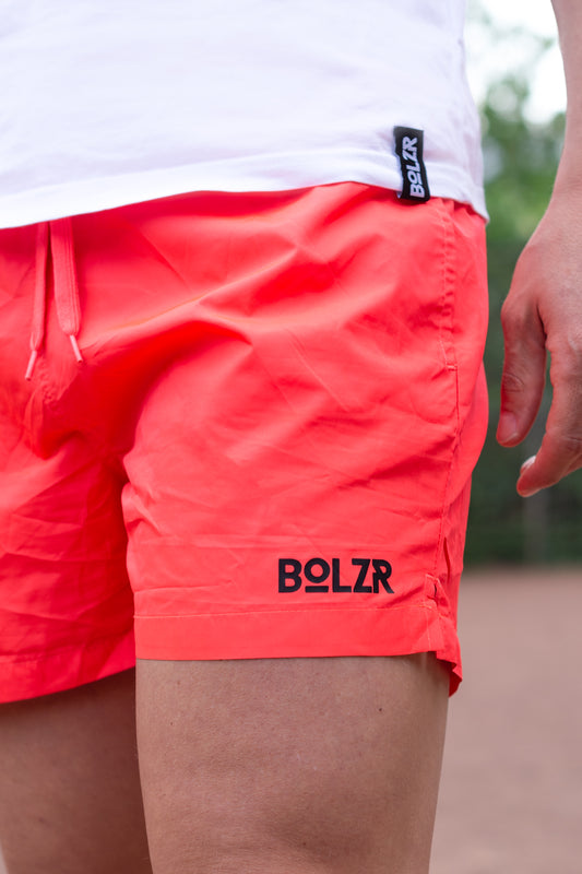 Bolzr swim shorts | outdoor pool | coral