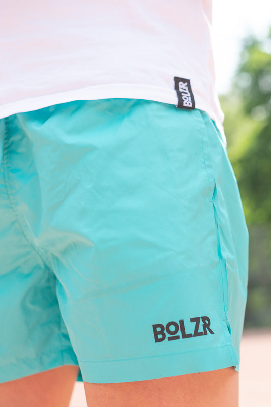 Bolzr swim shorts | outdoor pool | neon blue